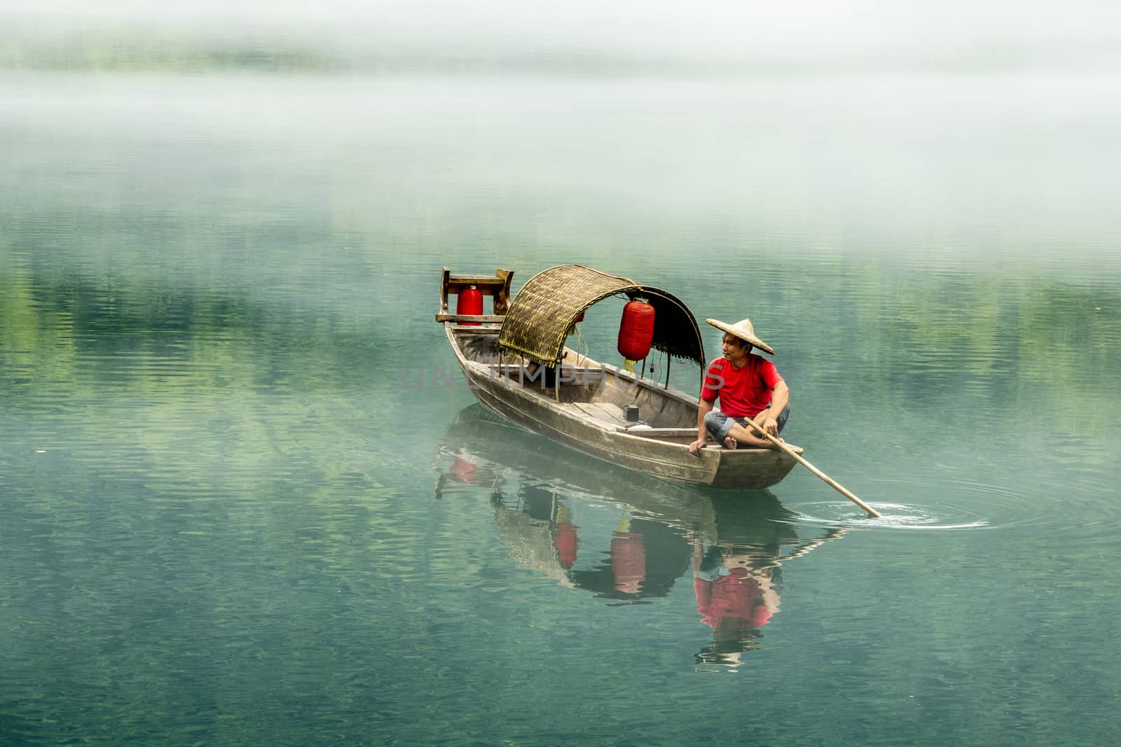 A fisherman in the famous Misty Small Dongjiang (east river) in Chenzhou, Hunan province of China.