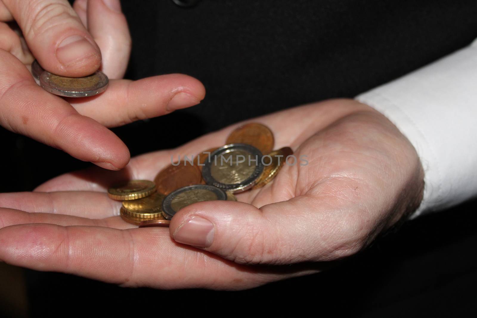 man hand holding a coins, finance concept, counting