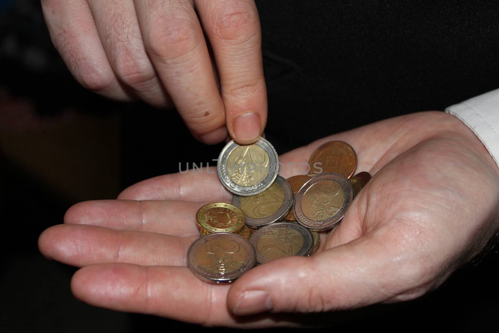 man hand holding a coins, finance concept by negmardesign