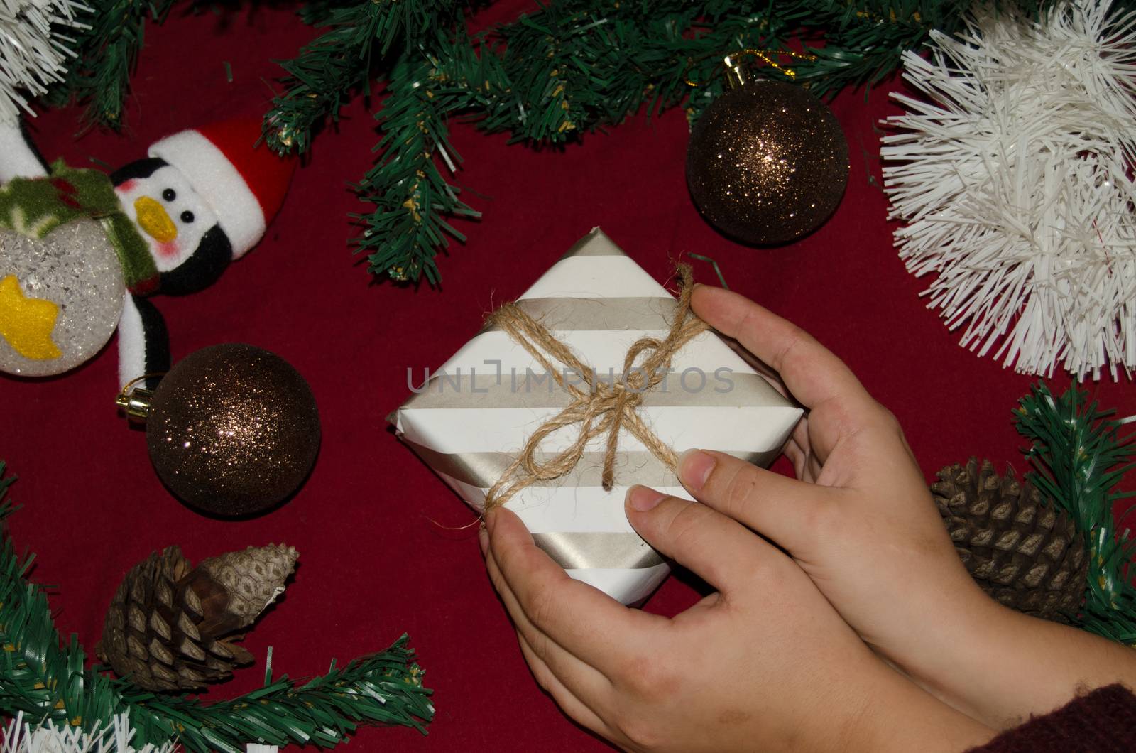 New year or Christmas flat lay top view of woman hands holding present by negmardesign