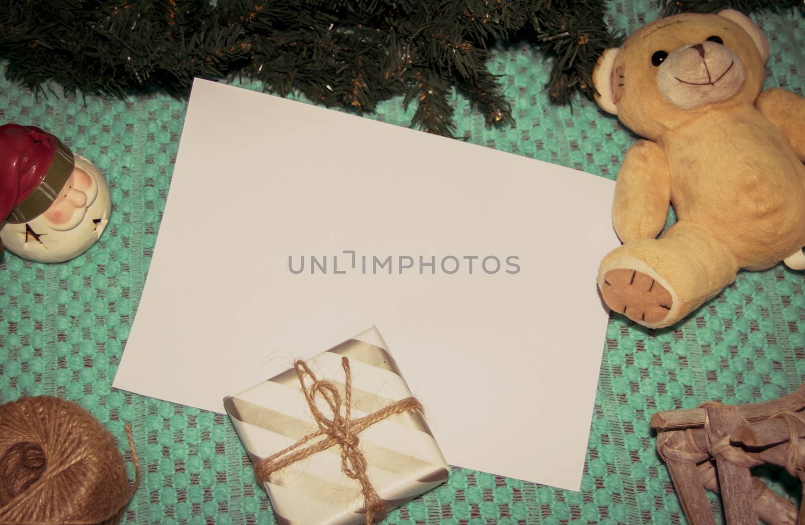 christmas decoration made from christmas tree and gift box on green background