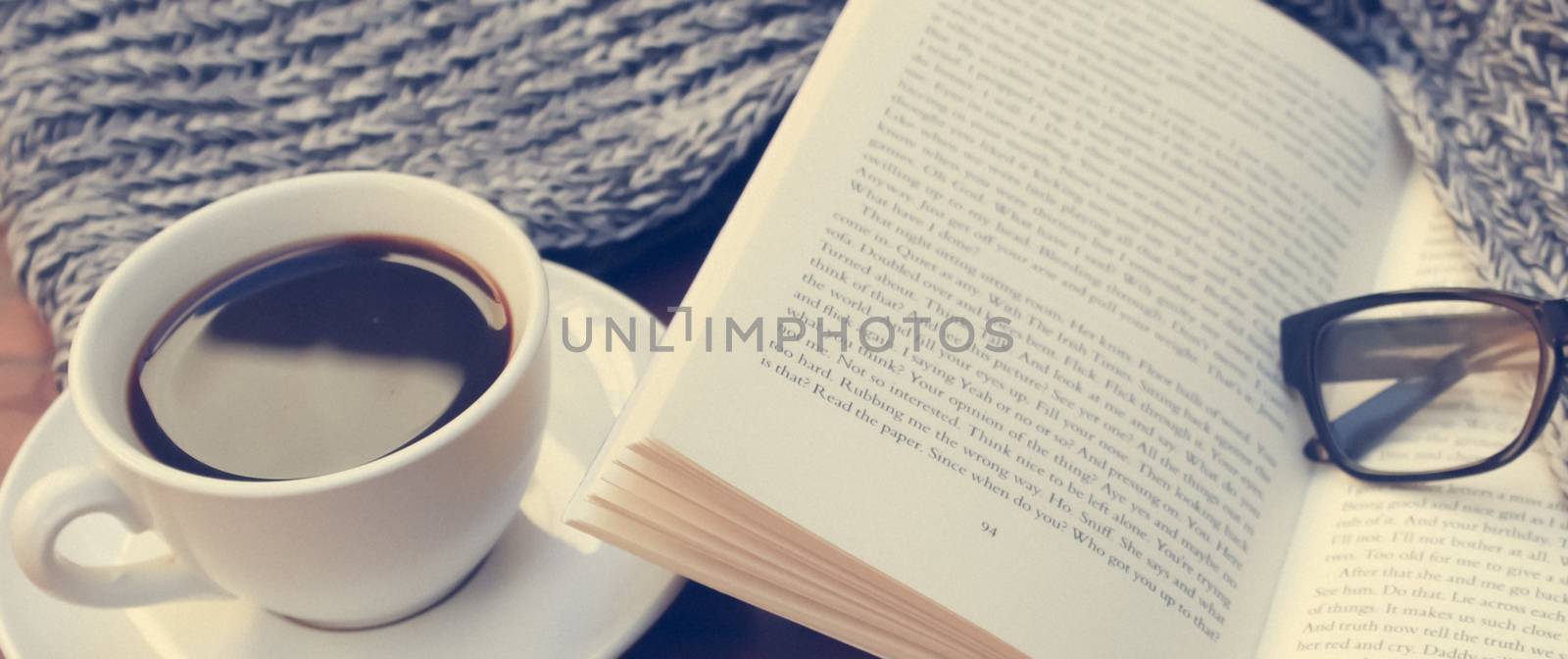 Coffe book scarf and glassess on the table, have a break
