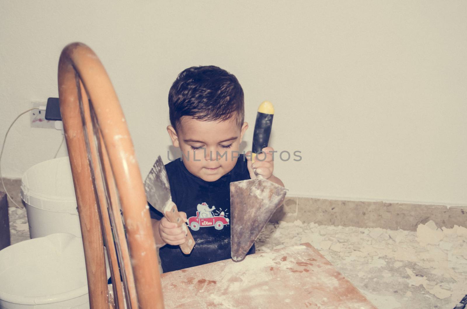 One and a half year old baby playing with painting tools by negmardesign