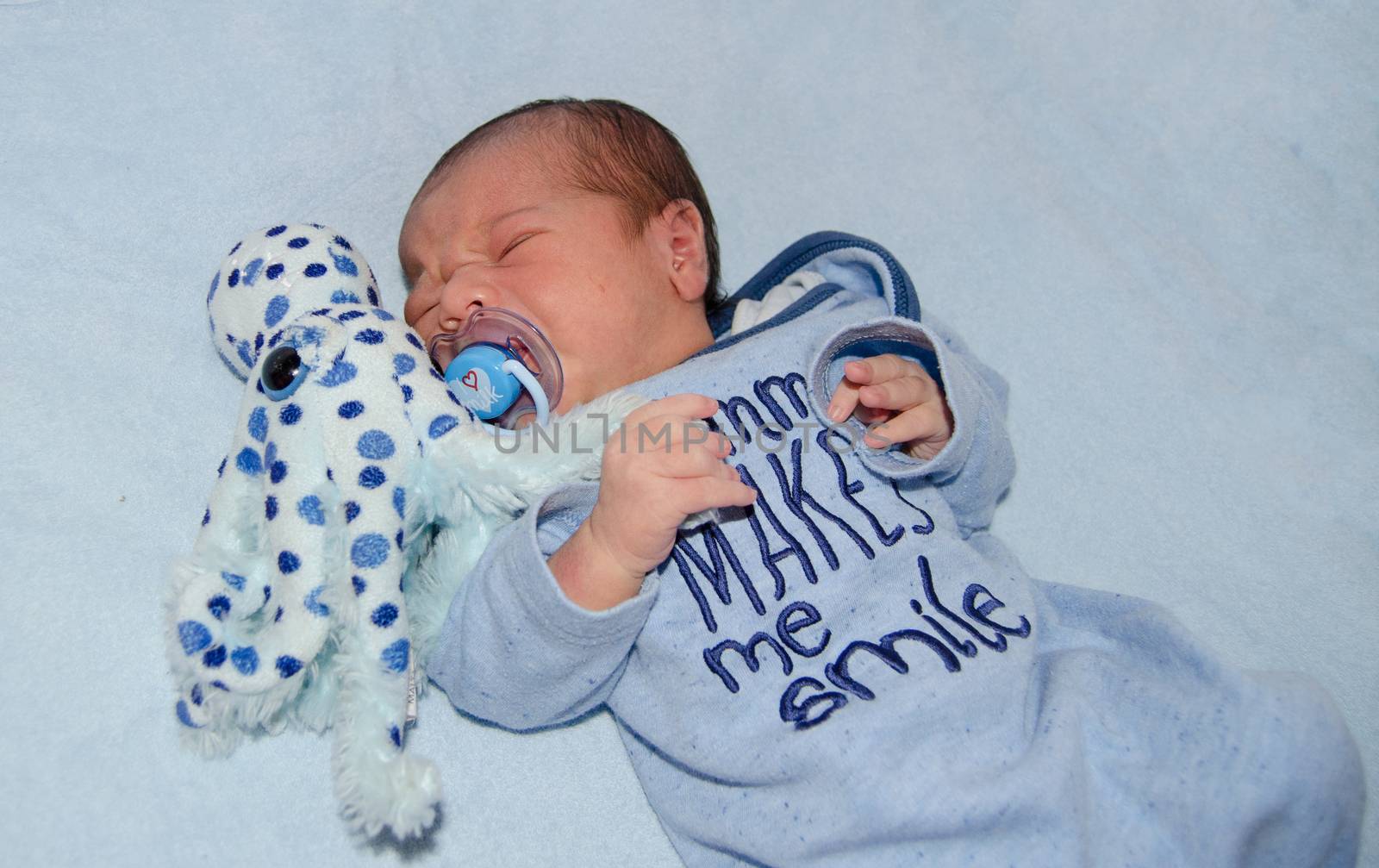 four days old newborn baby boy crying in the cot by negmardesign