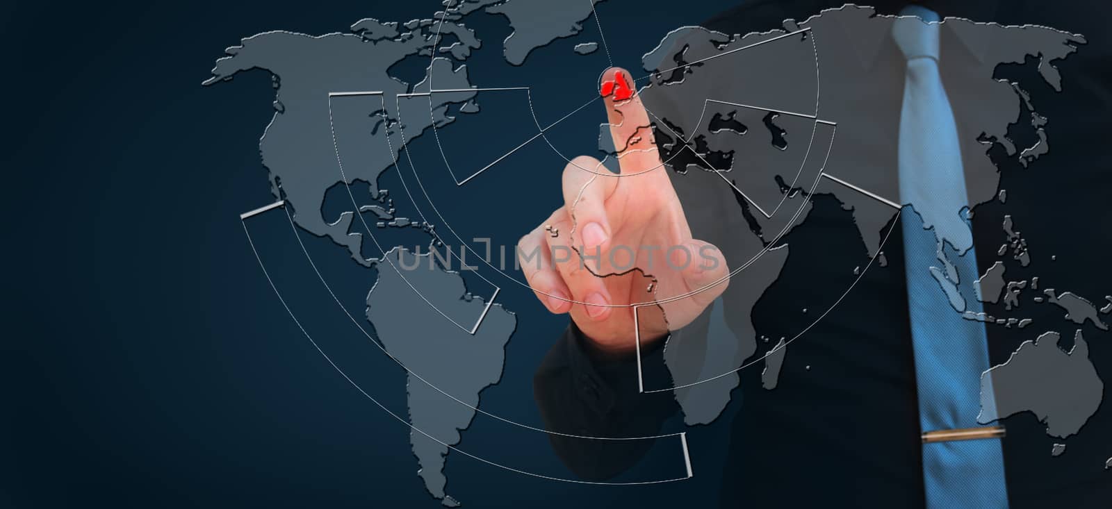 Busieness man pointing finger on UK on the hologramic world map, brexit concept