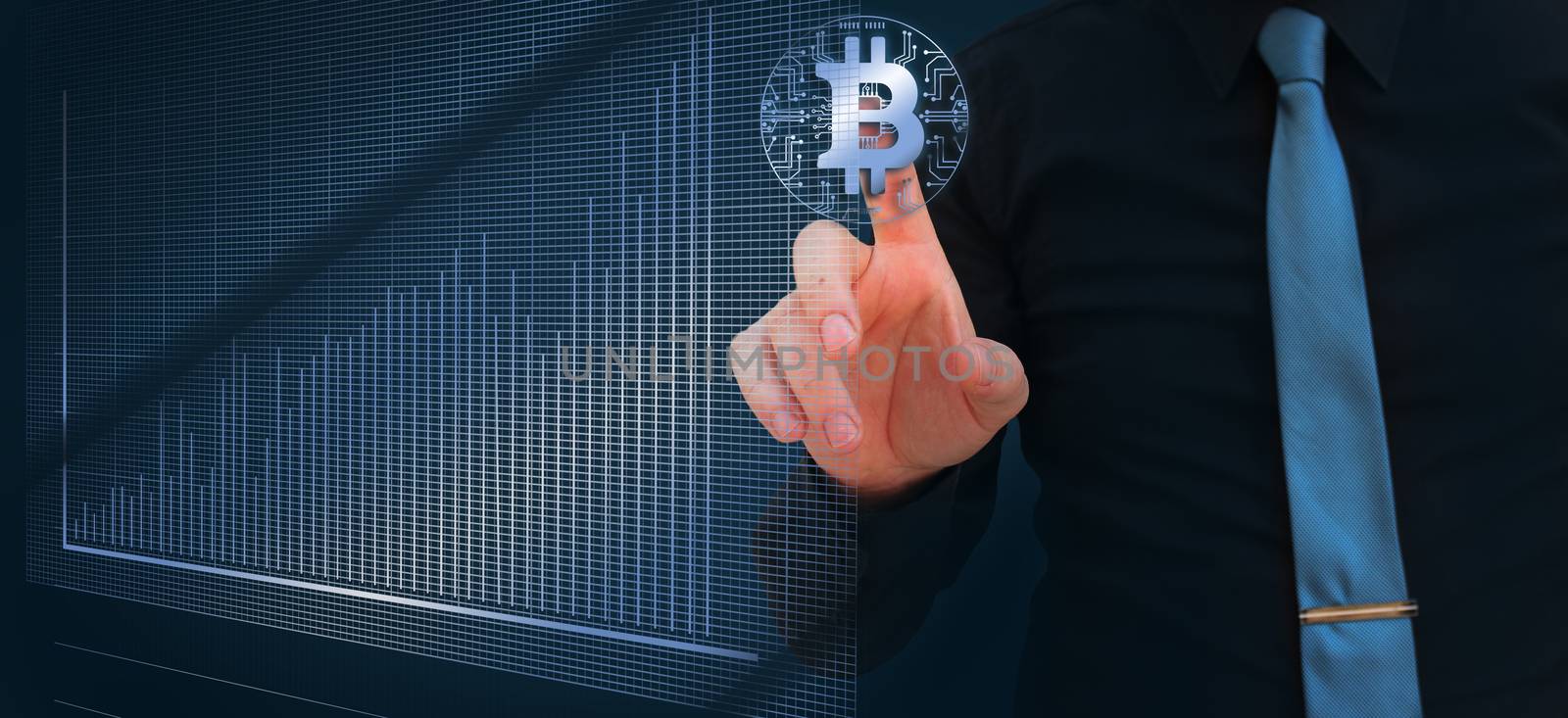 businessman pointing finger on the bitcoin digital cryptocurrency with stock market chart by negmardesign