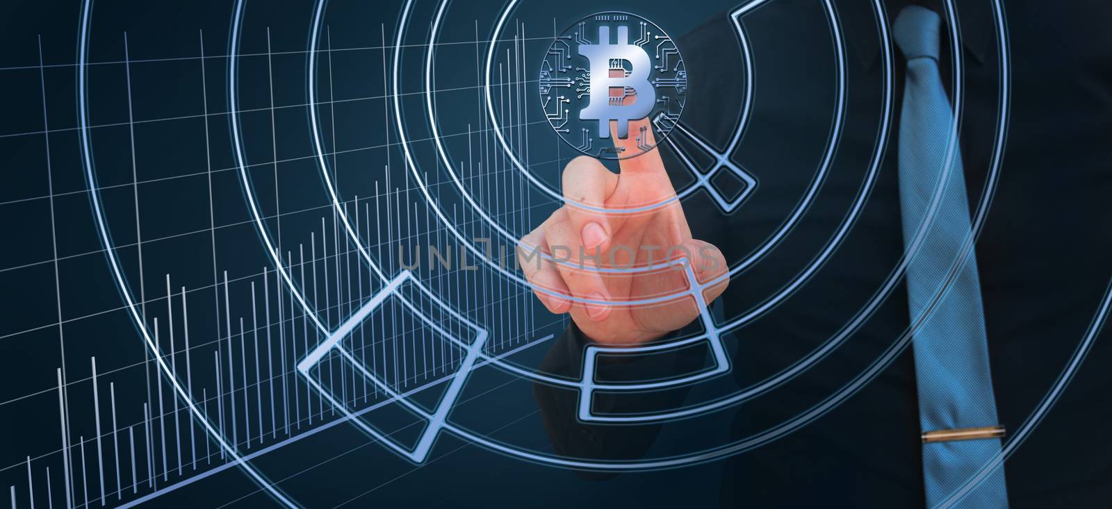 businessman pointing finger on the bitcoin digital cryptocurrency with stock market chart by negmardesign