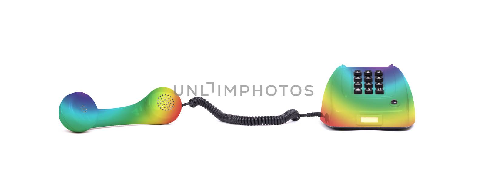 Vintage rainbow colored telephone with a white background