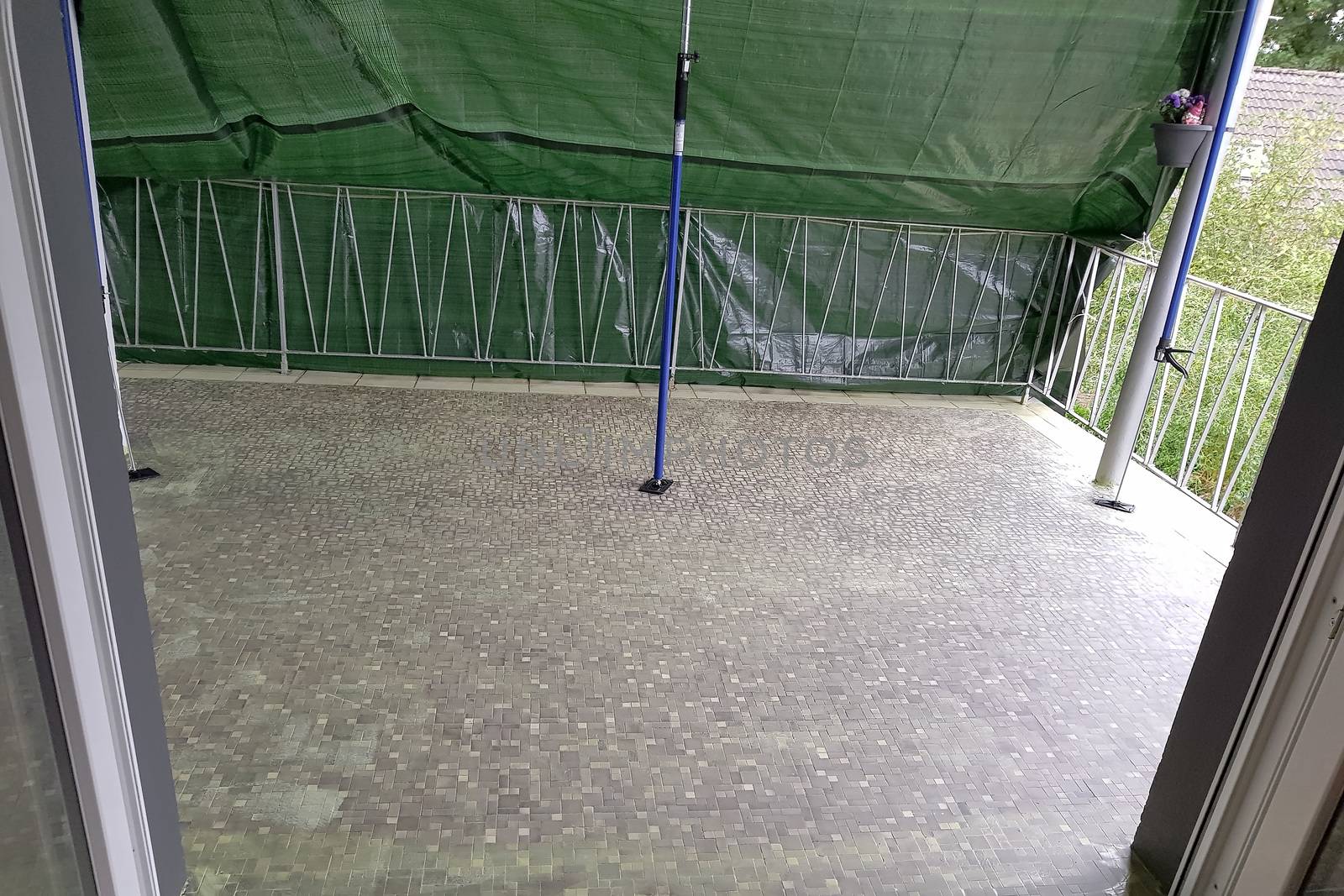 Balcony floor tiles installation. Laying tiles from porcelain. Interior remodeling theme.