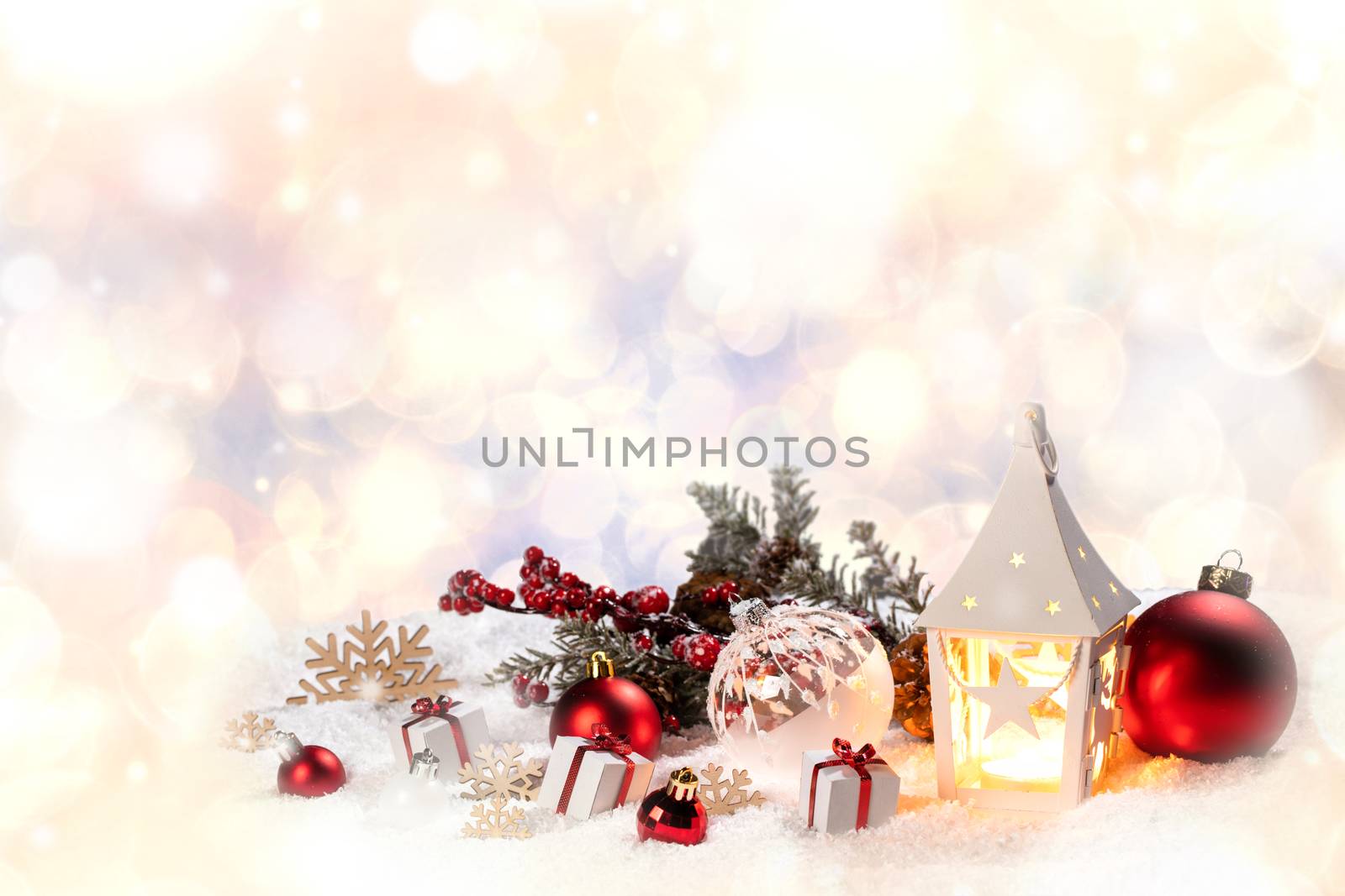 Christmas holidays card with gifts , balls , santa claus hat and glowing lantern in snow