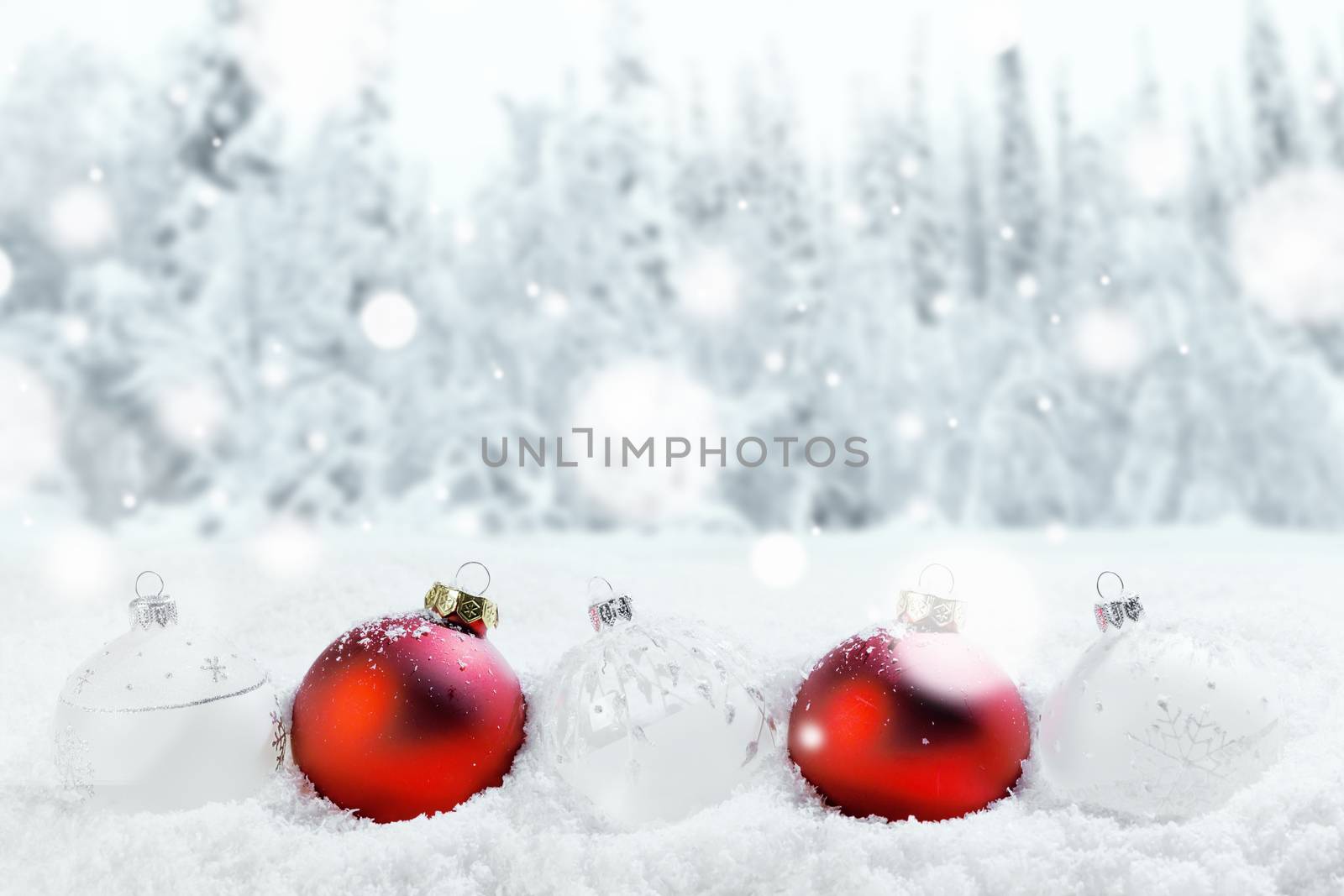 Merry Christmas and Happy New Year greeting card with balls in a row and falling snow . Background with copy space .