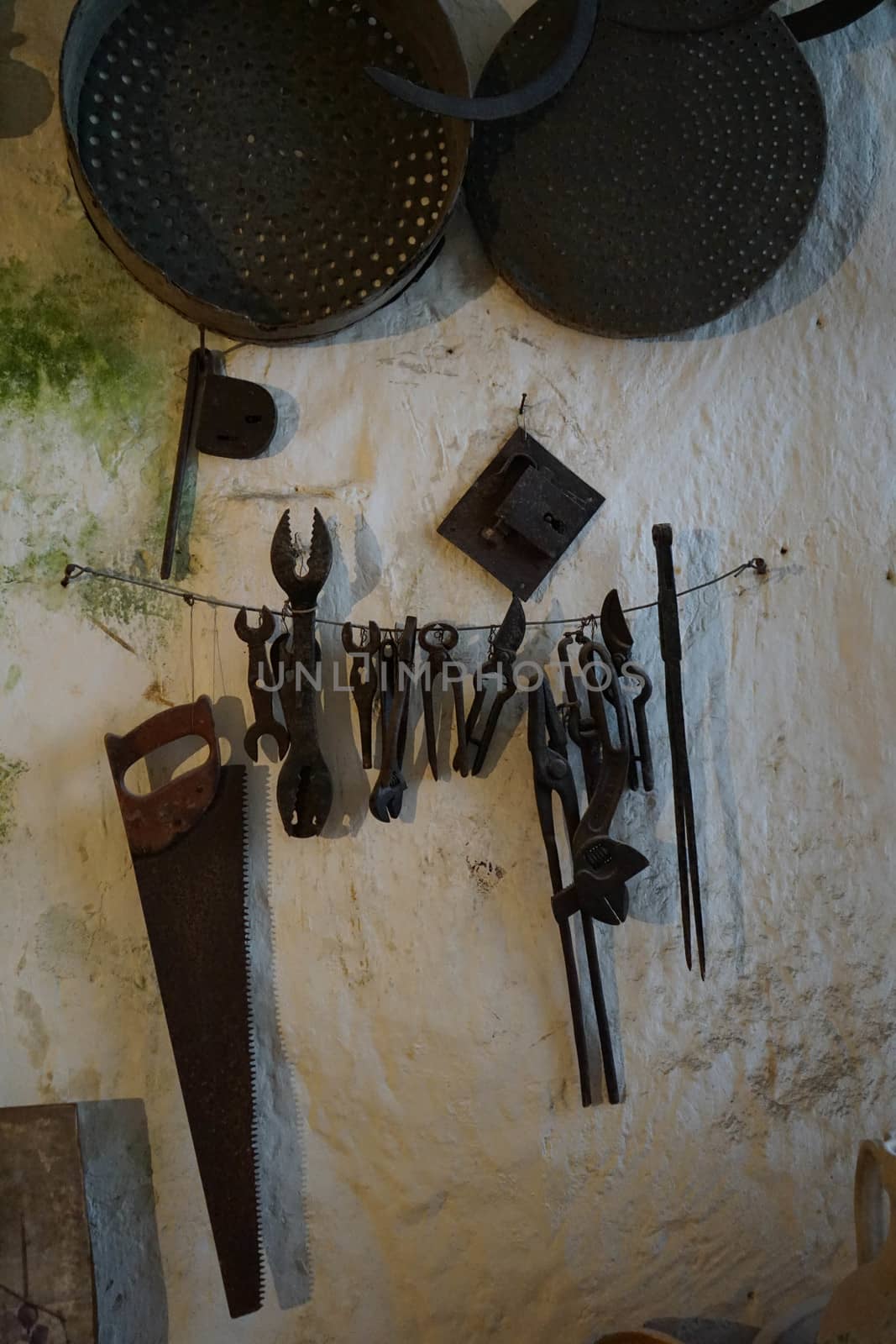 Old tools working in a cave house in Matera