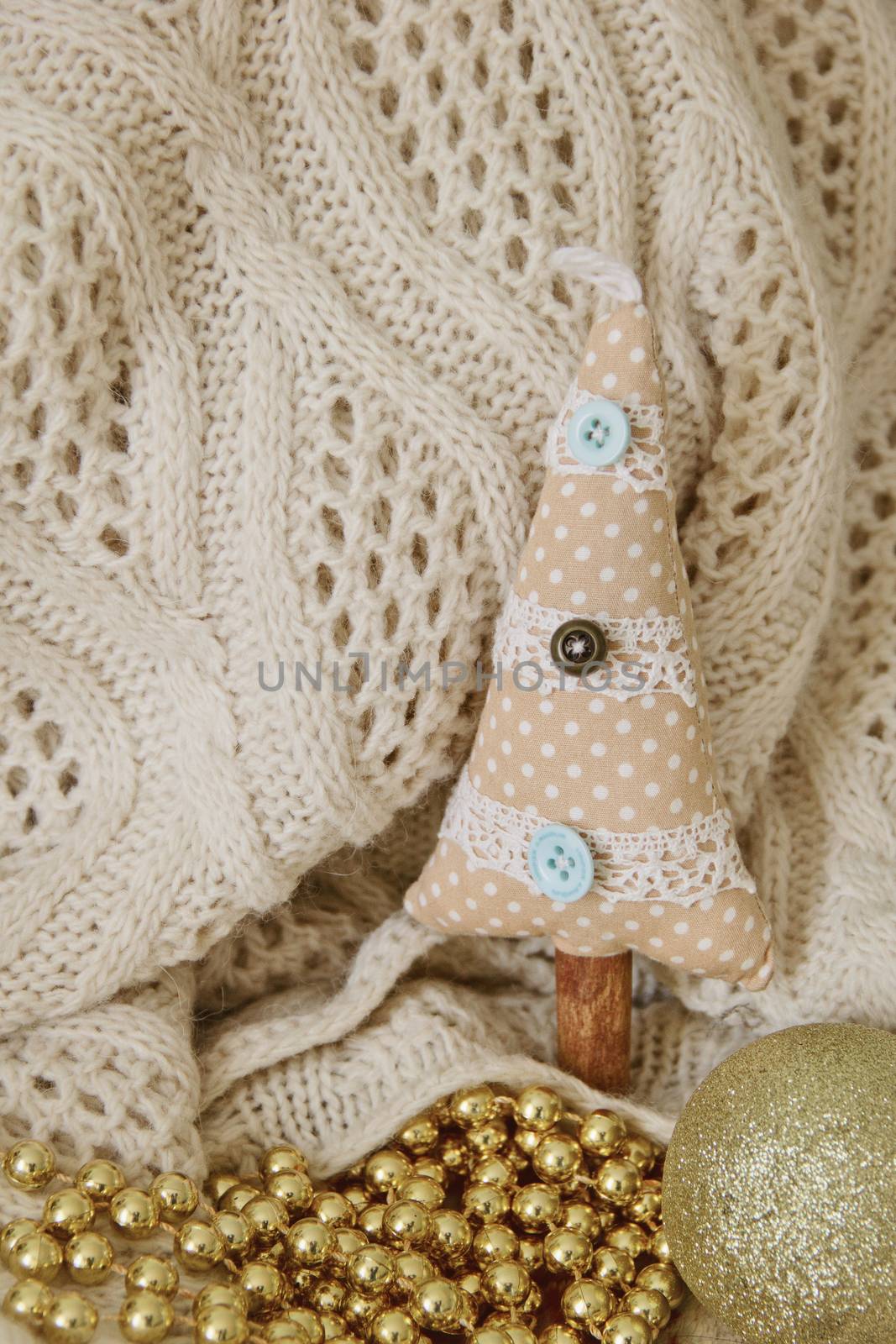 textile handmade toy beige fir tree for Christmas. background. Photo
