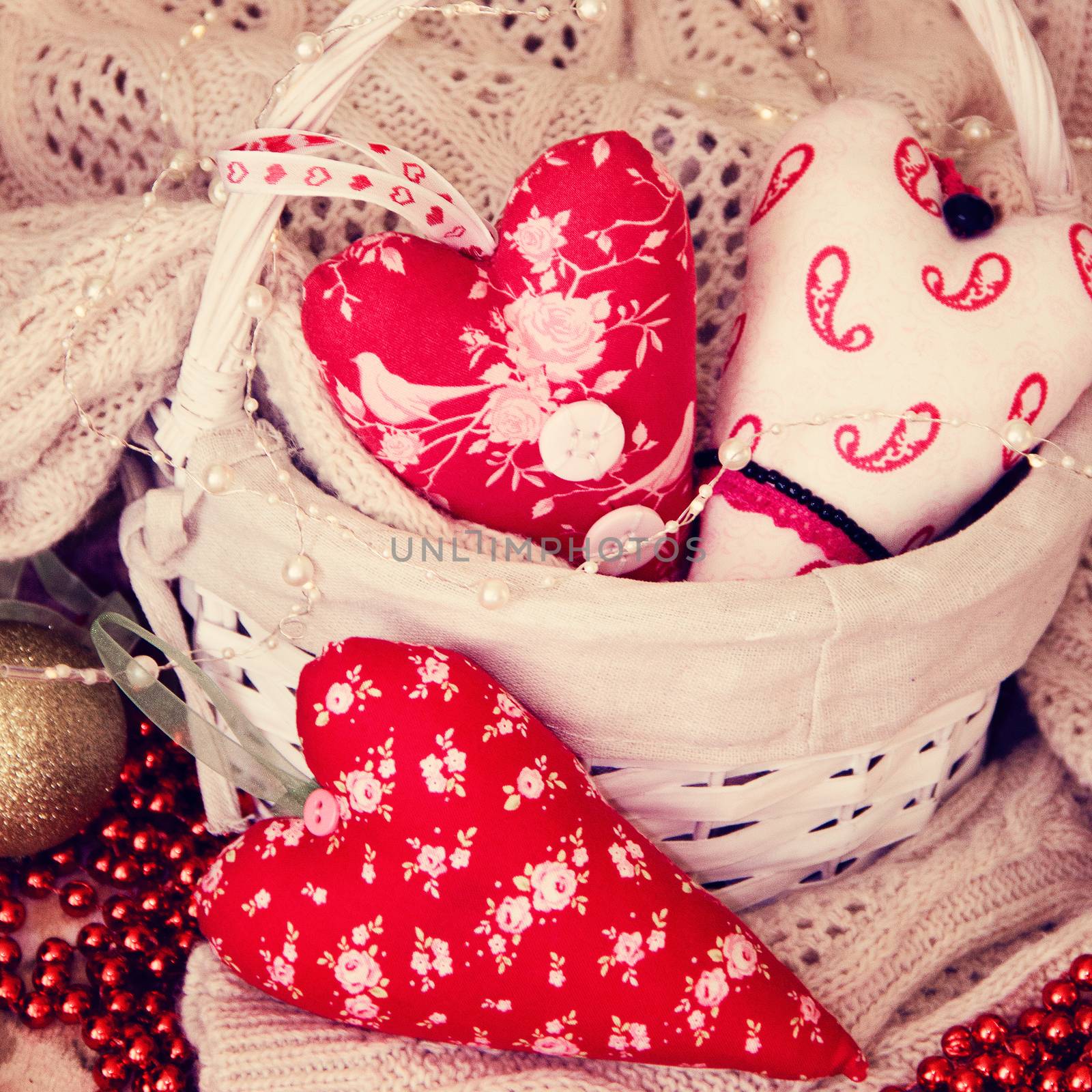 textile handmade toys three big red hearts for Christmas. background. Photo