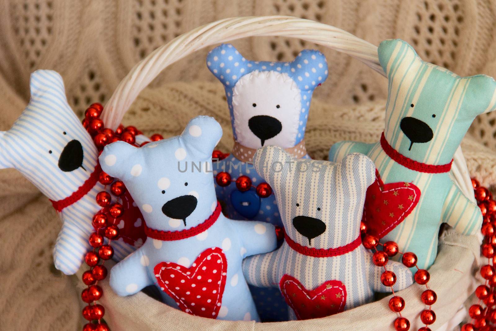 Handmade five Teddy bear for Valentine day on basket. Background. photo