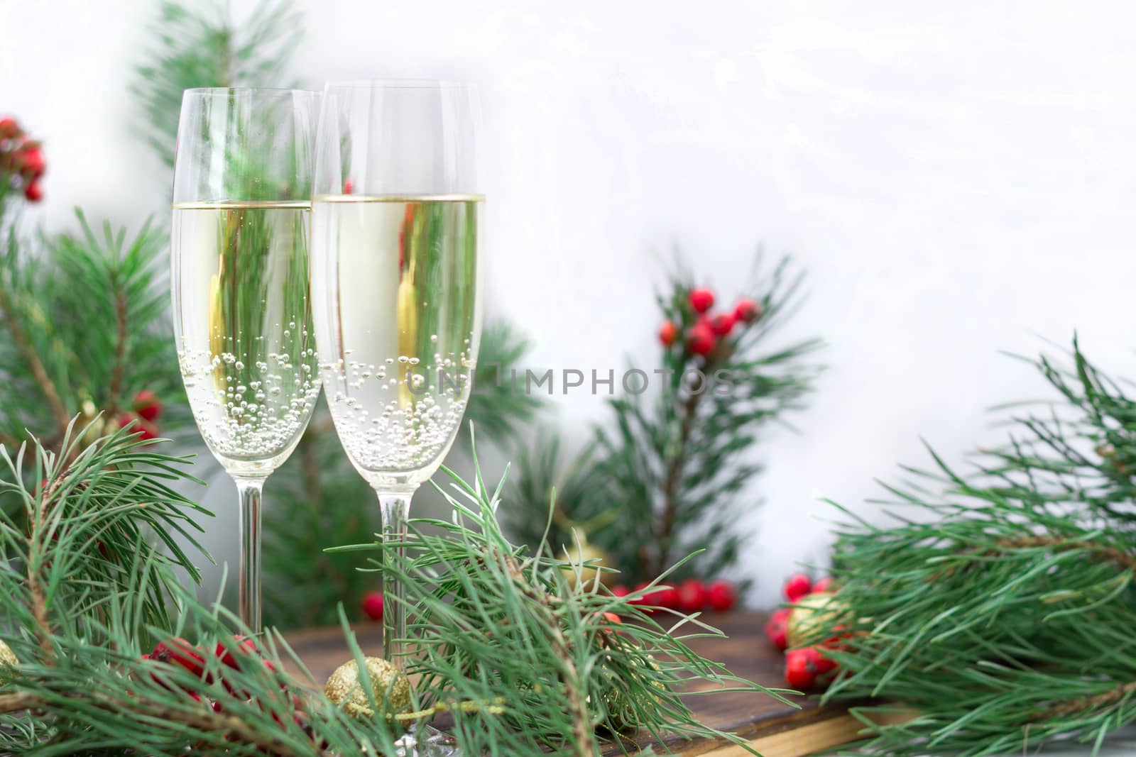 Christmas holiday still life, champaign, pine branches, red berr by VeraVerano