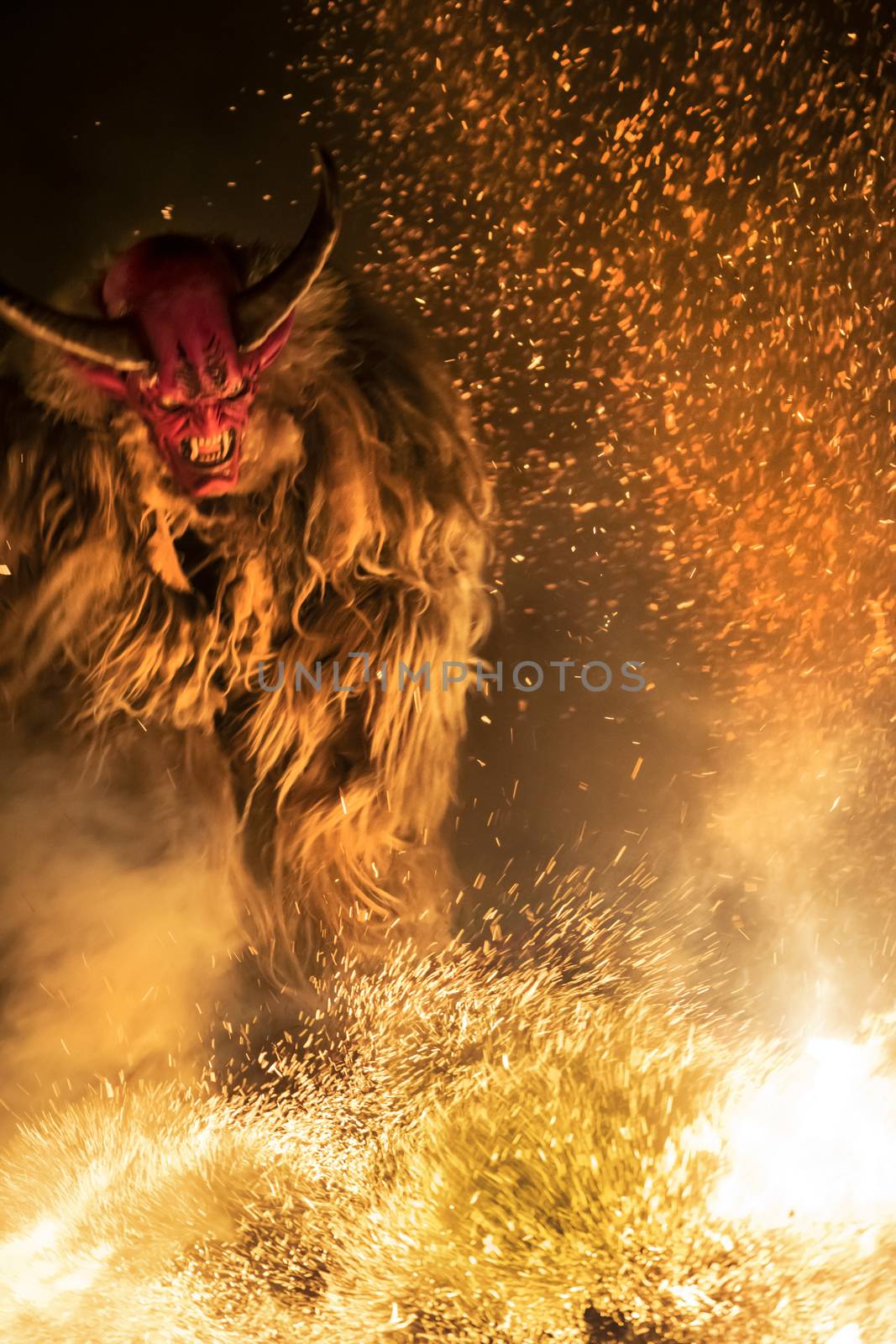 The Krampus masks in an exhibition in the night in Tarvisio, Italy