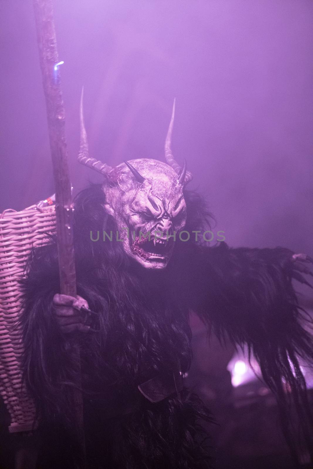 The Krampus masks in an exhibition in the night in Tarvisio, Italy