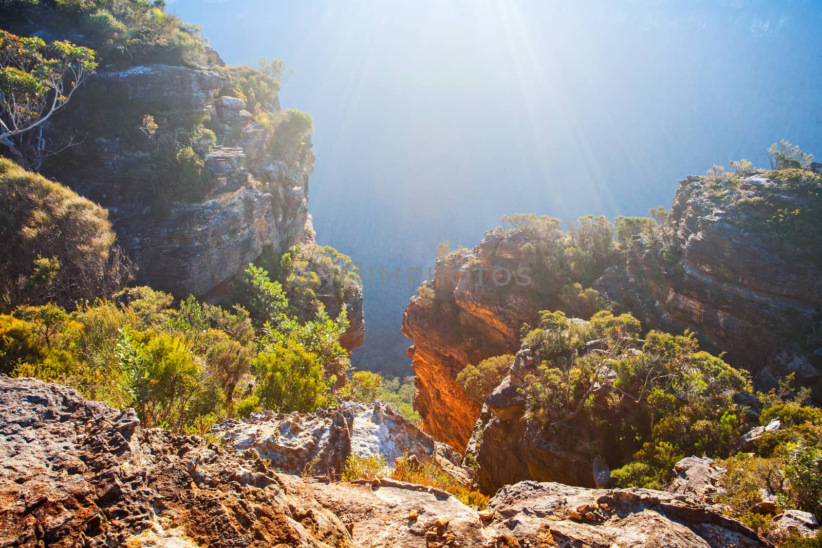 Views from the short ridge pass with sunlight streaming into the valley nd highlighting the sandstone walls of one of the canyons. The light reminds me of an underwater scene