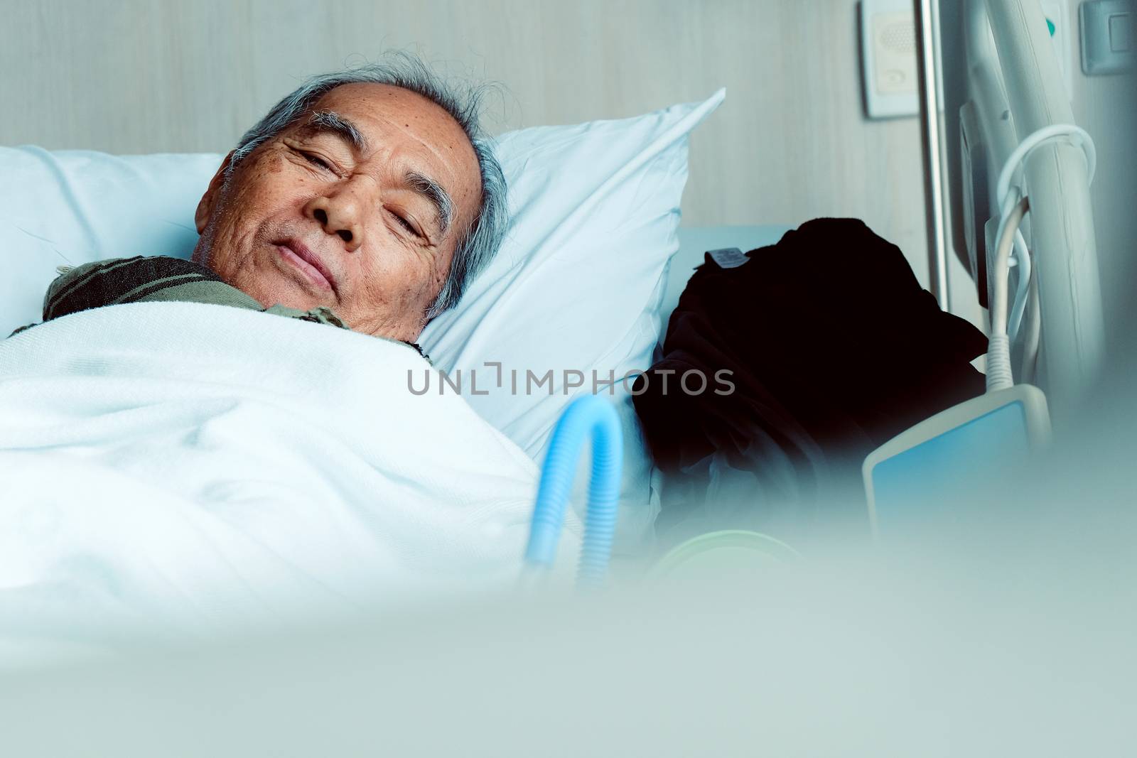 Elderly patients in hospital bed
