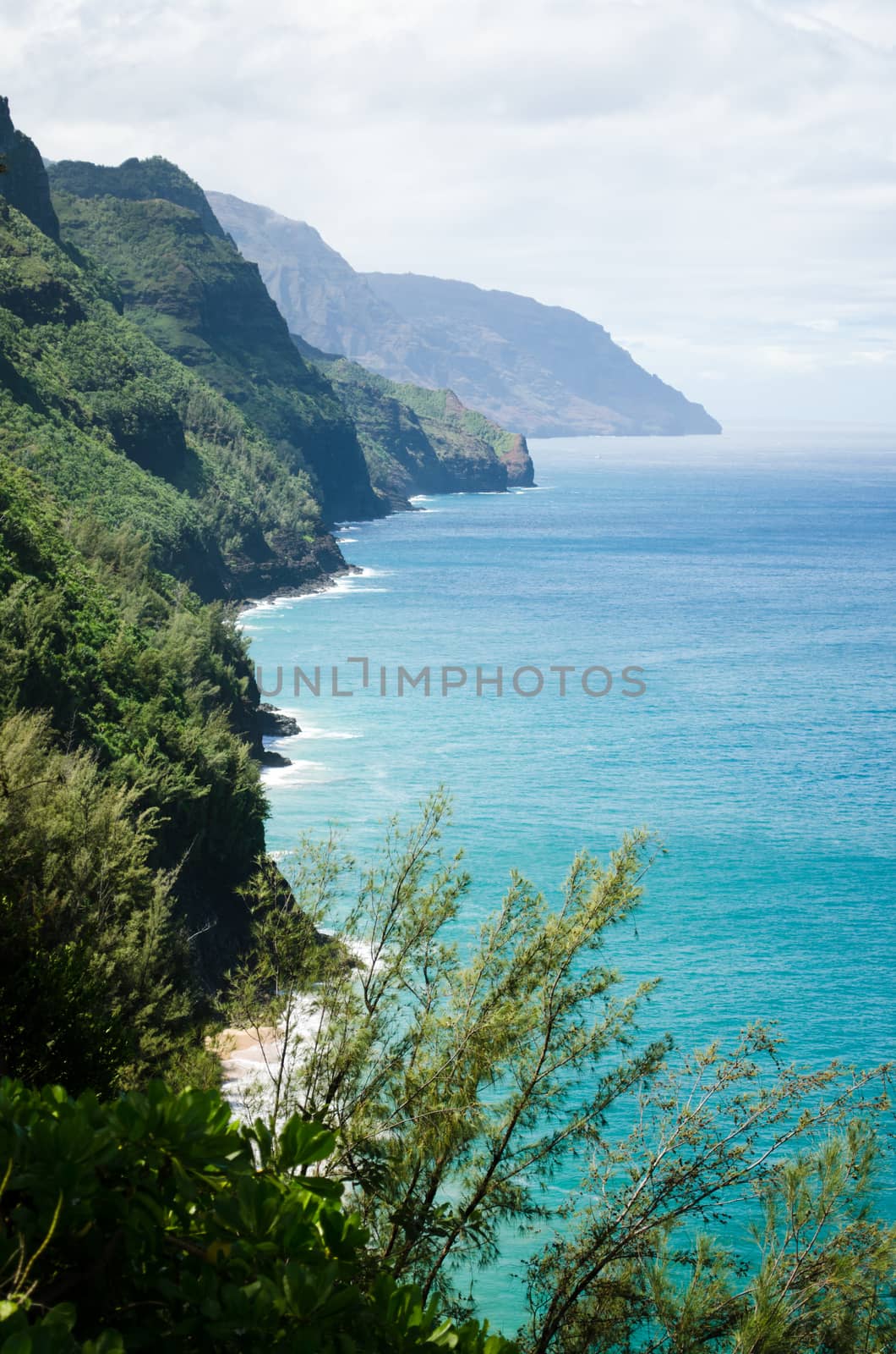 Abrupt mountains and shores seen from a view point in the Kalalau Trail in Kauai, Hawaii, US