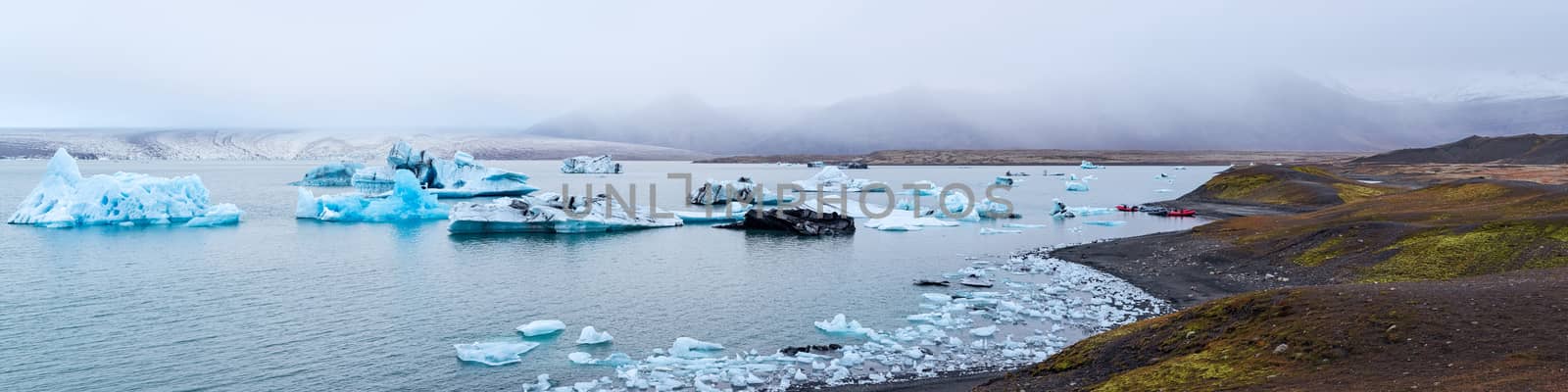 Icebergs in the Jokulsarlon's lake near Vatnajokull glacier in a panoramic view, Iceland