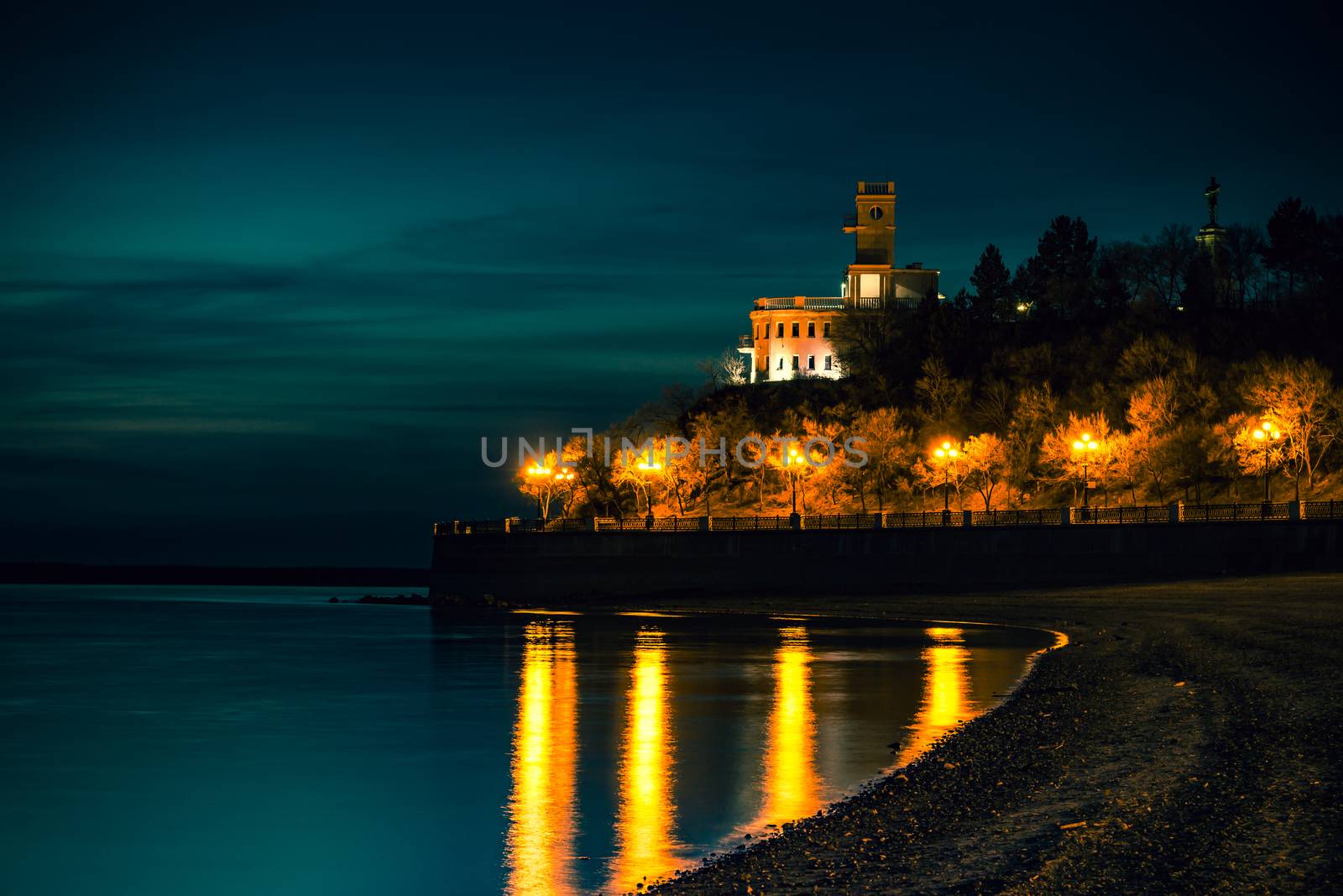 Amur Cliff at night. Lit by lanterns.