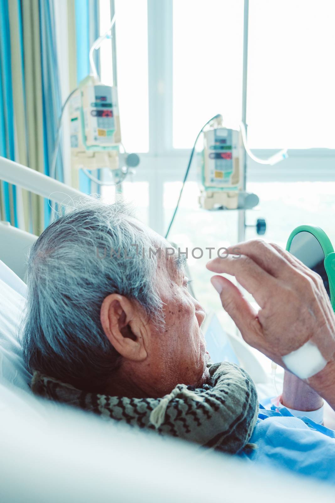 Elderly patients relax in hospital bed