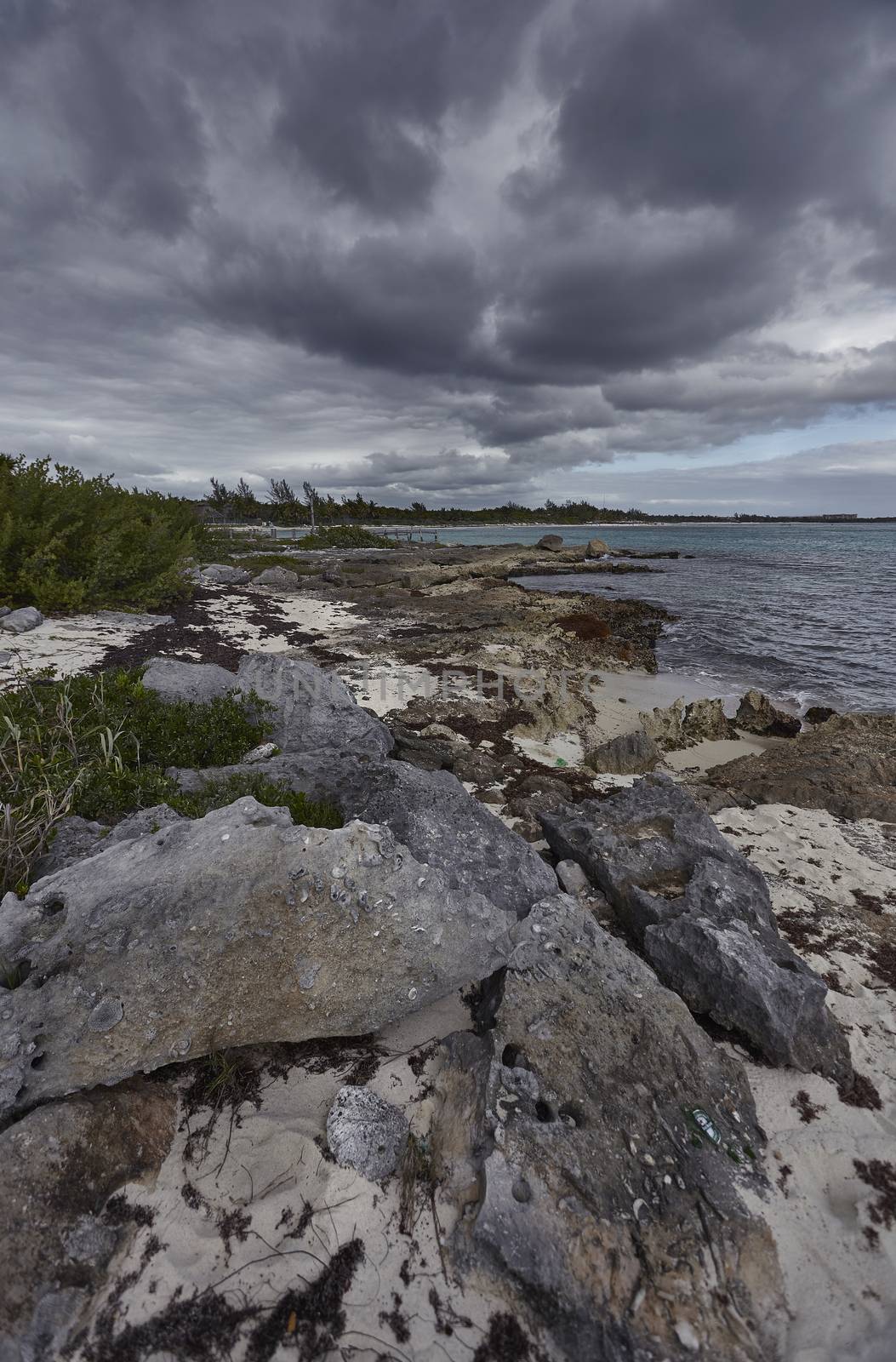 View of Xpu-Ha beach in Mexico under a sky that promises storm.