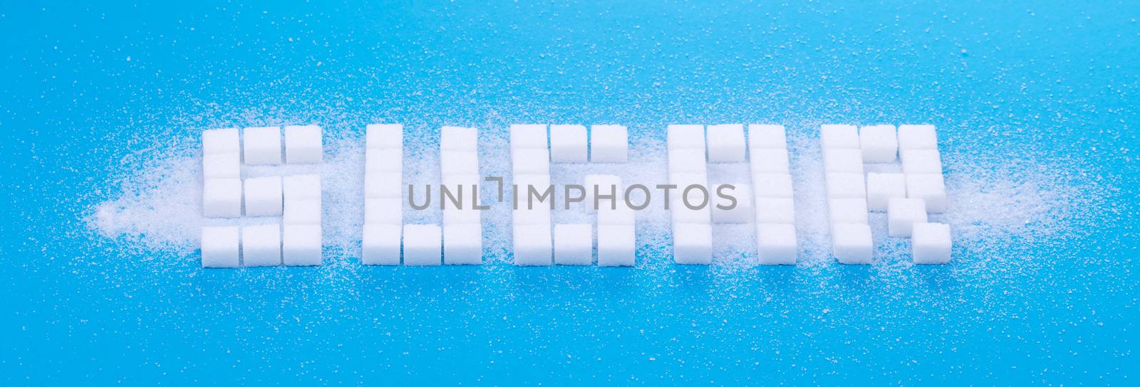 White sugar cubes background - Concept of unhealthy eating