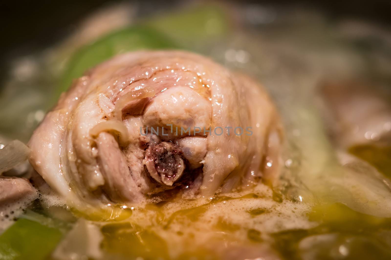 closeup of a cooking homemade chicken bouillon in a pot
