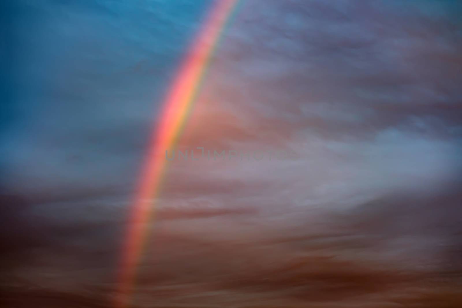 image of a rainbow in the sky at the evening in Bavaria
