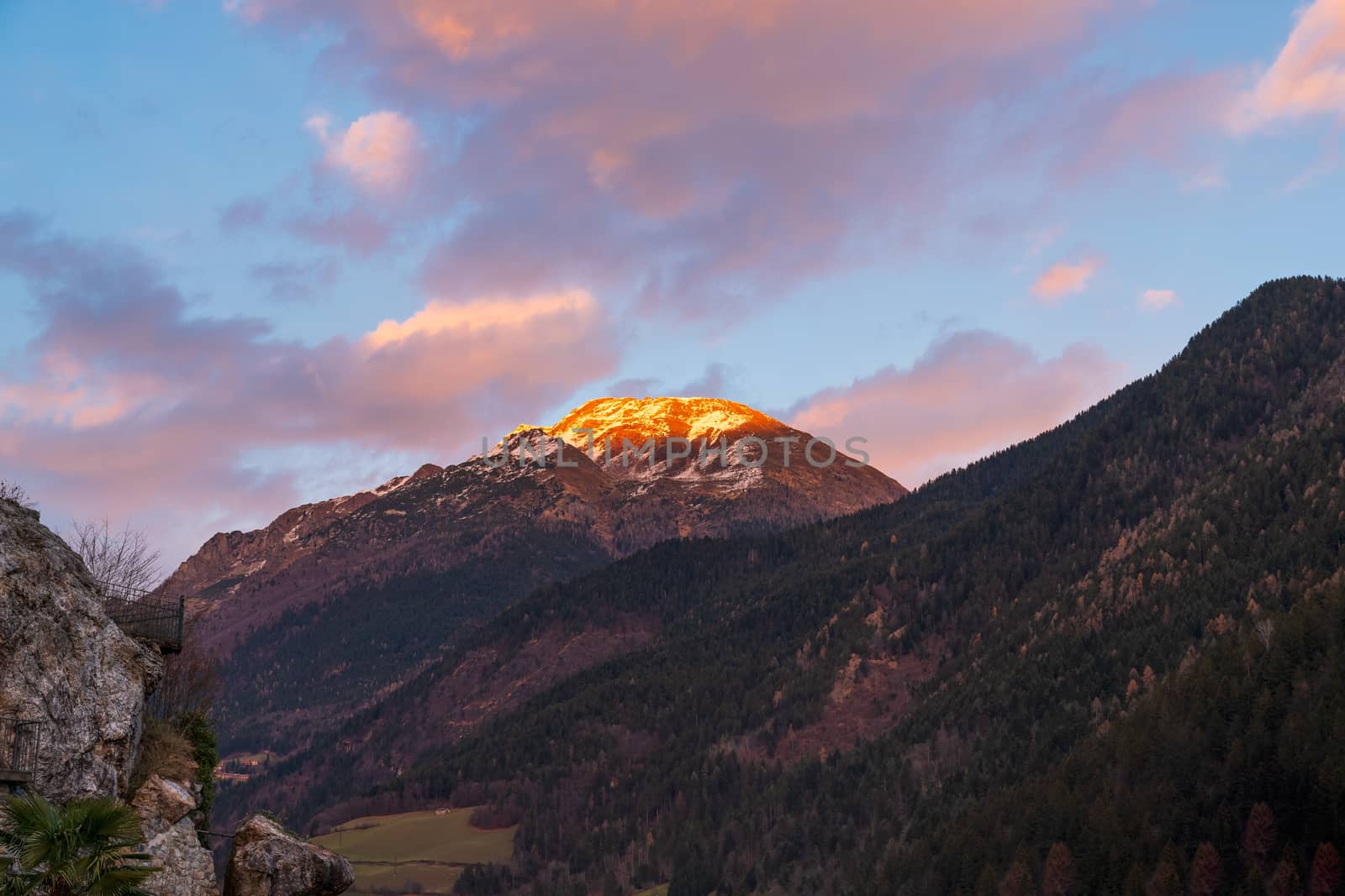 Awesome panorama of the snow-covered Orobie mountains of the Seriana Valley and the Sedornia Valley at sunset.