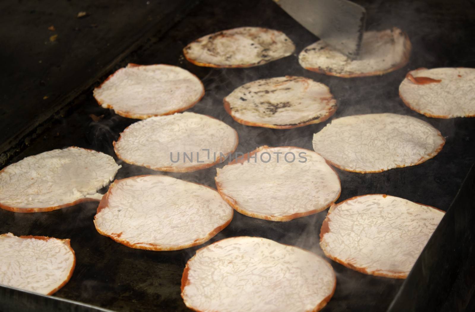 Meat on the grill, roasting meat on an ember with fire