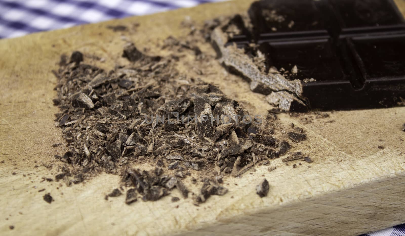 Grated black chocolate tablet, sweets and desserts