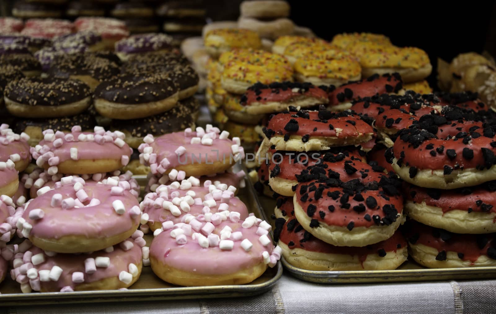 Donuts with chocolate and caramel in pastry, food and desserts