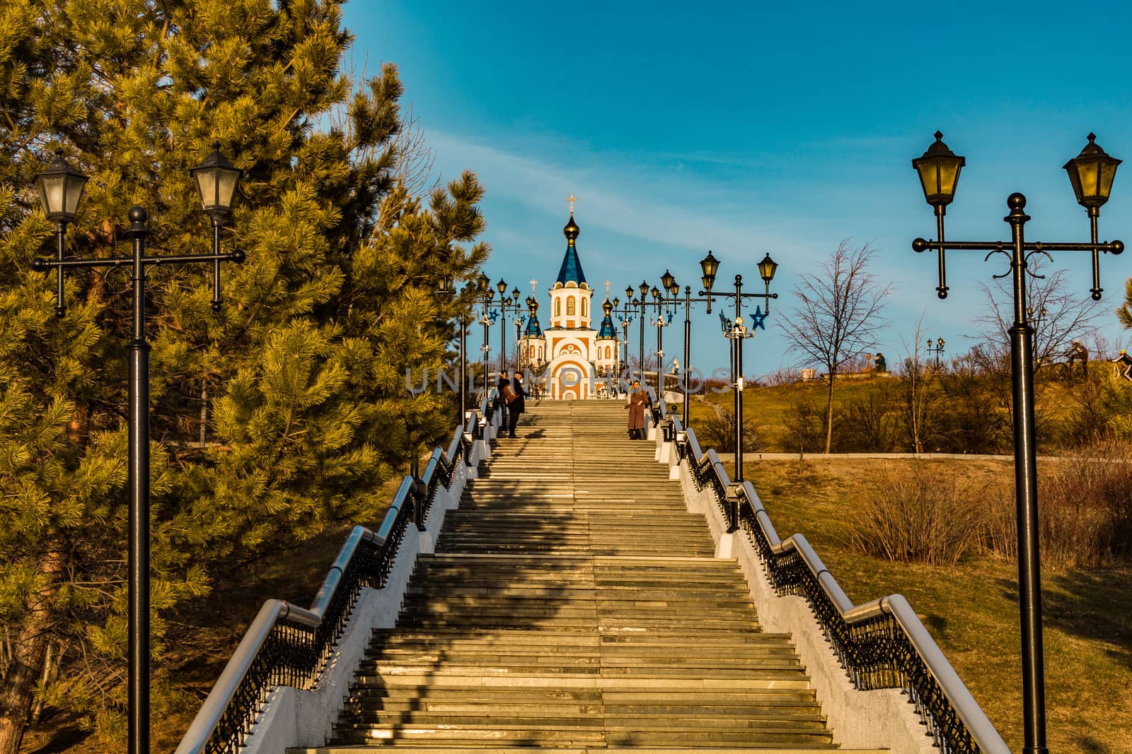 stairs from the embankment of the Amur river, ending at Komsomolskaya square. On the horizon Grado-Khabarovsk Cathedral of the assumption of the Mother of God