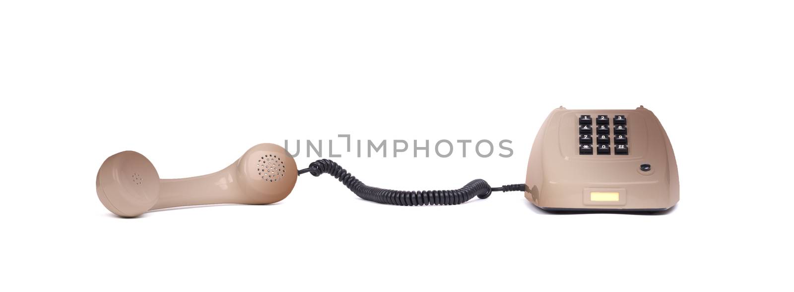 Vintage brown telephone with a white background