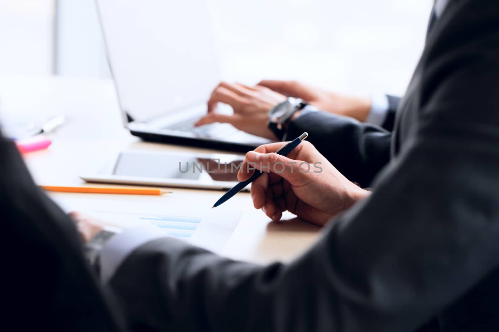 Business people working together with financial reports
