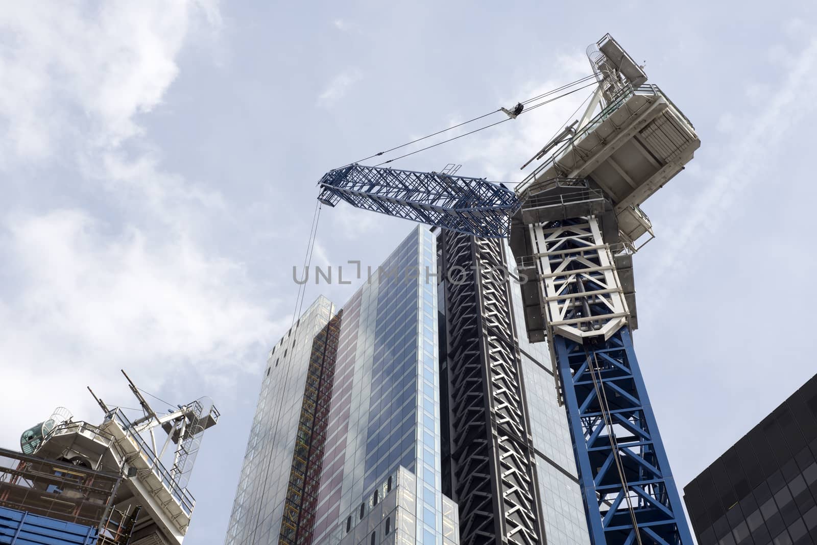 the construction of a london city skyscraper with a crane