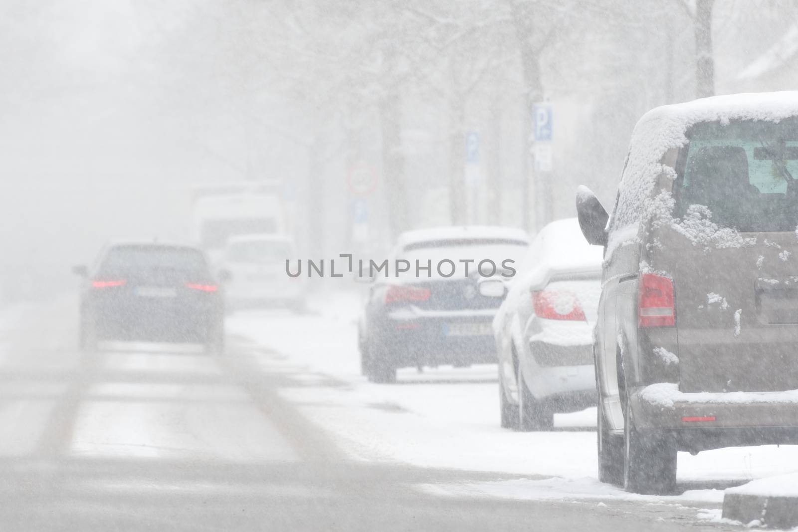Driving car in heavy snowfall in Winter in Germany