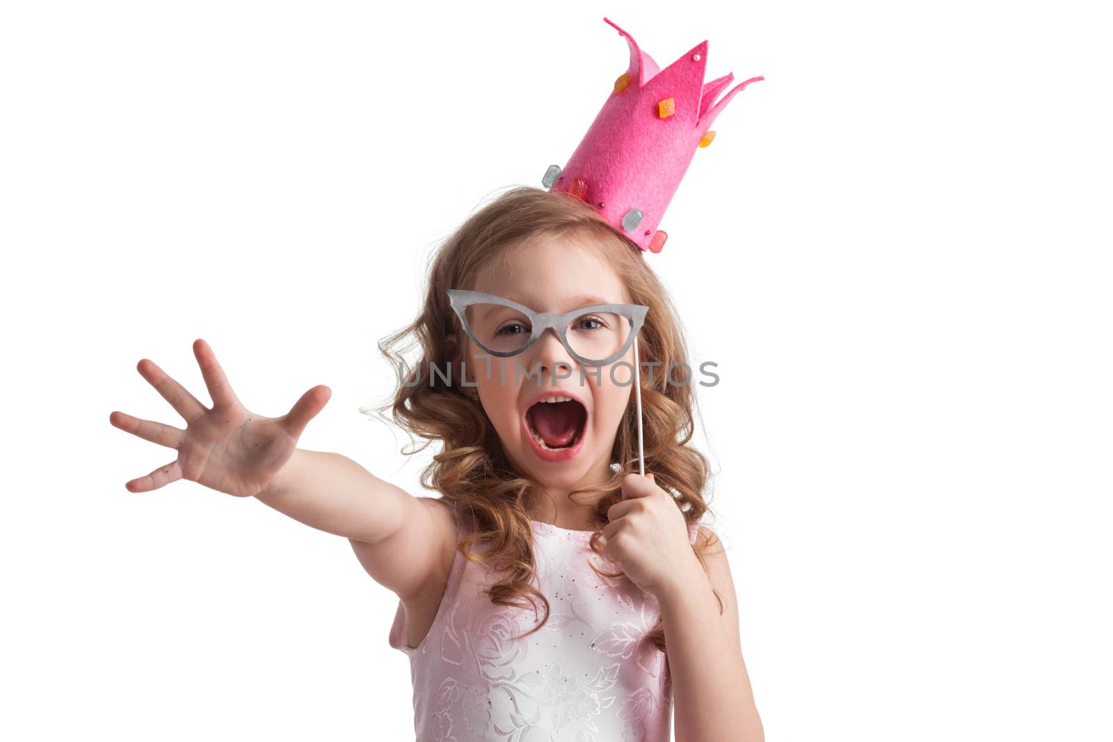 Beautiful little candy princess girl in crown holding fake party glasses on stick to her face , white background