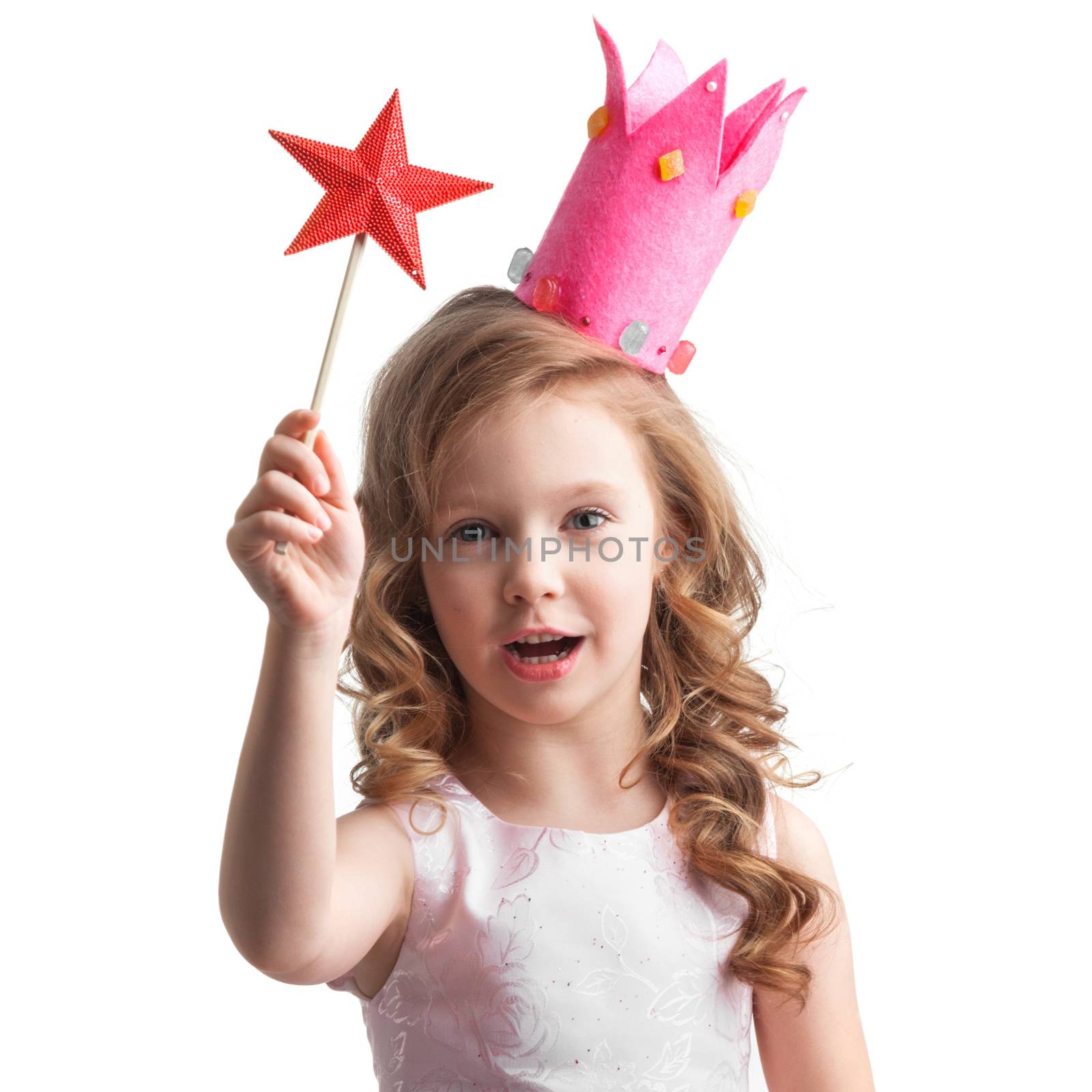 Beautiful little candy princess girl in crown holding star shaped magic wand and making a wish