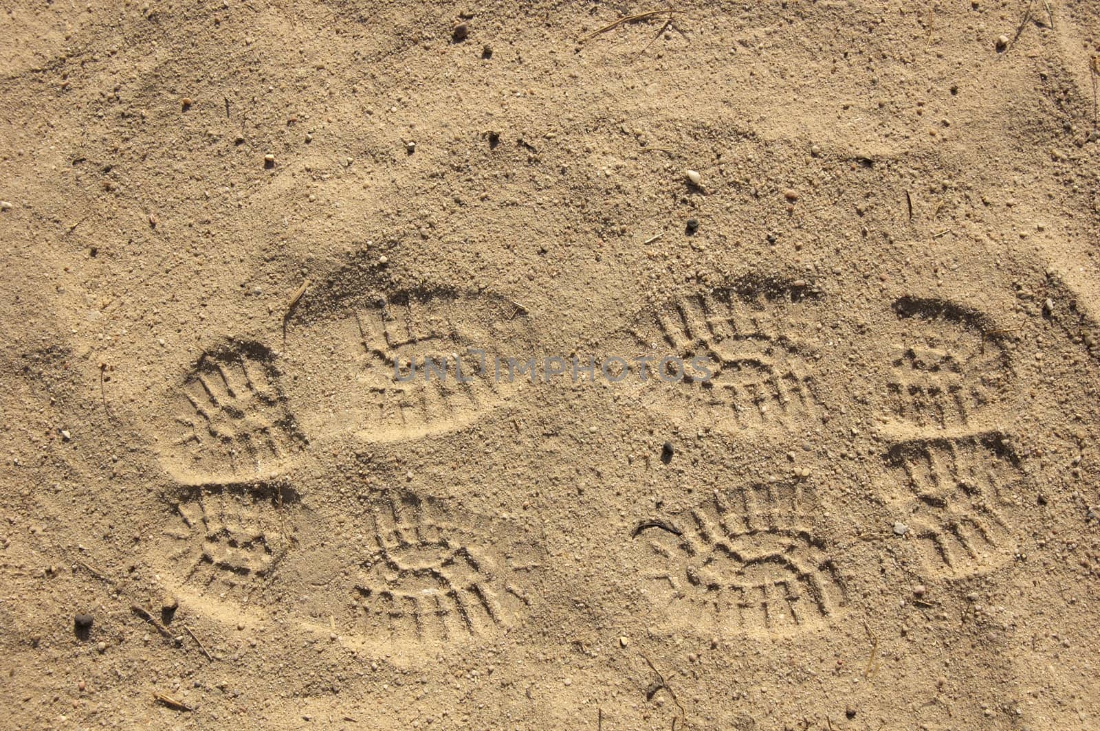 This image shows footsteps on sand