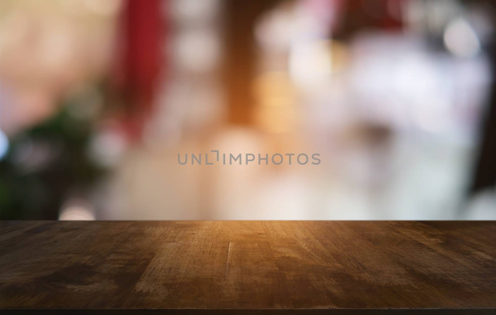 Empty dark wooden table in front of abstract blurred bokeh backg by peandben