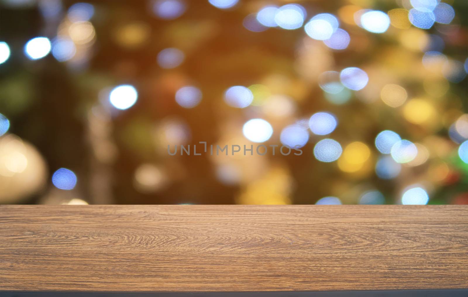 Empty dark wooden table in front of abstract blurred bokeh background of restaurant . can be used for display or montage your products.Mock up for space