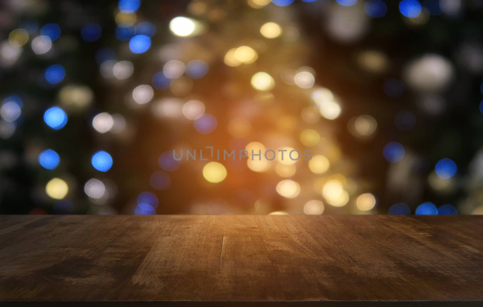 Empty dark wooden table in front of abstract blurred bokeh background of restaurant . can be used for display or montage your products.Mock up for space