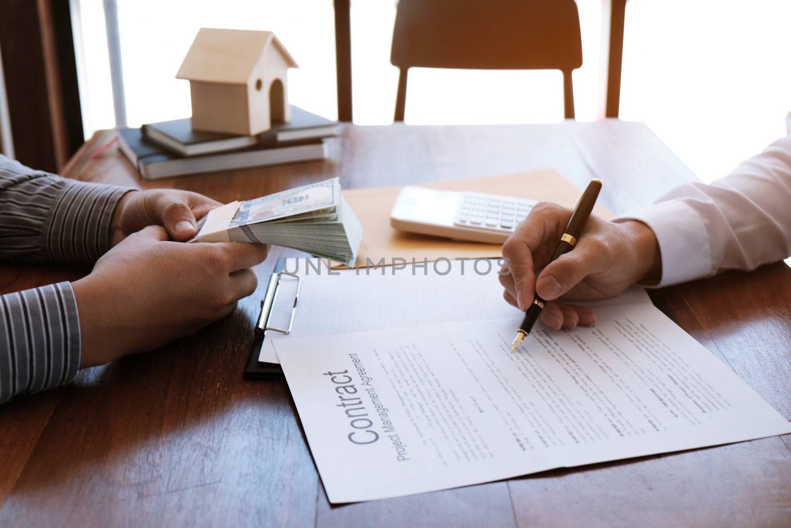 Business people signing contract making a deal with real estate agent Concept for consultant and home insurance concept