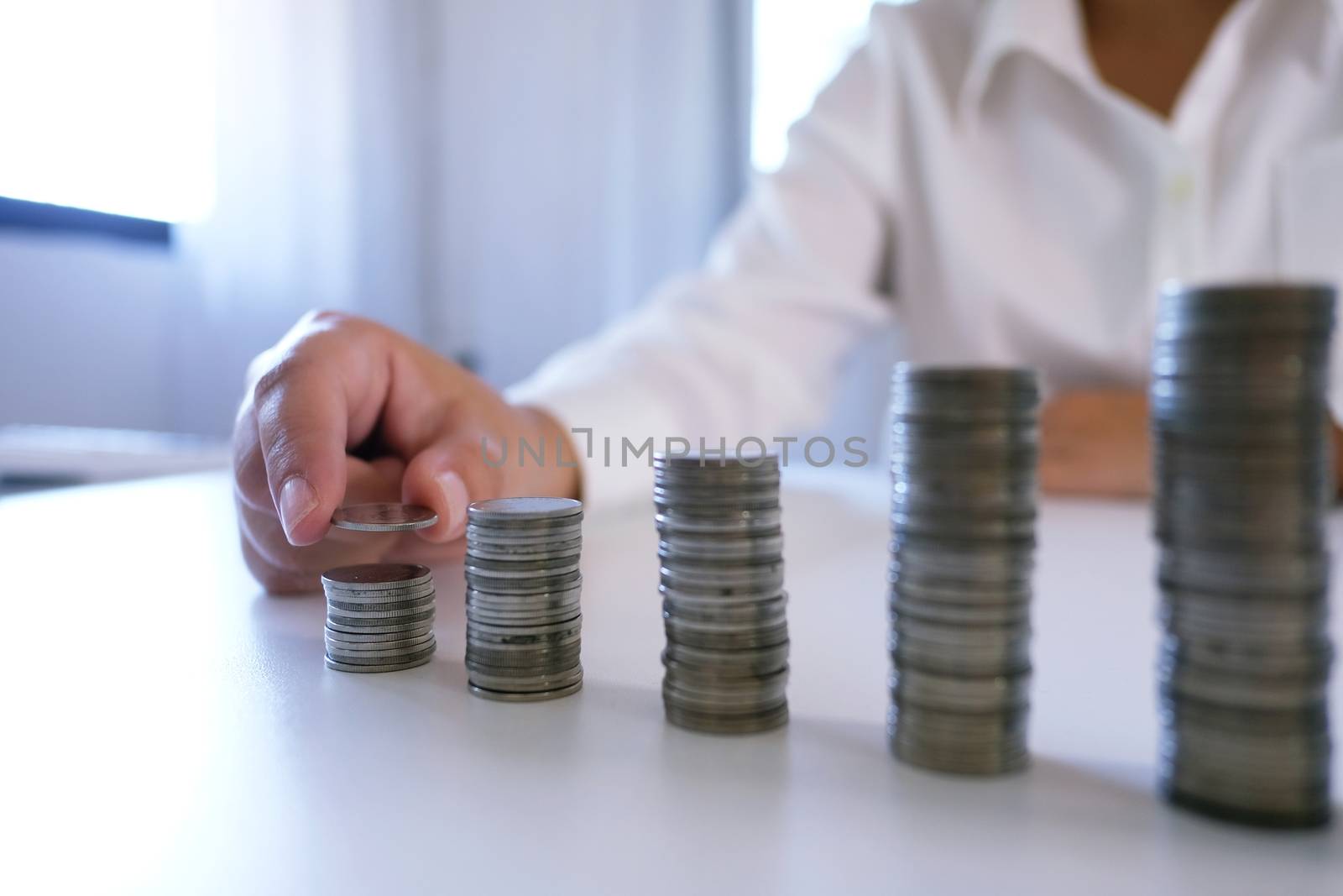 Female hand stack coins  growing business. Saving money. by peandben