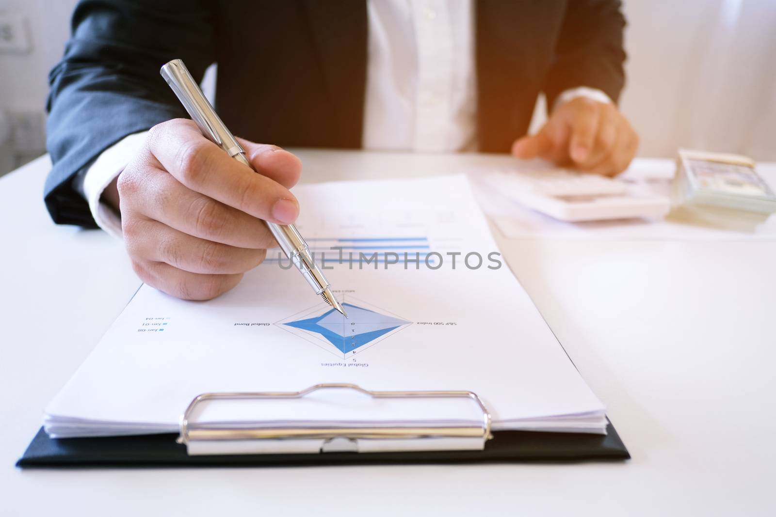 Accountant Working man uses calculator with Spreadsheet document, information financial concept